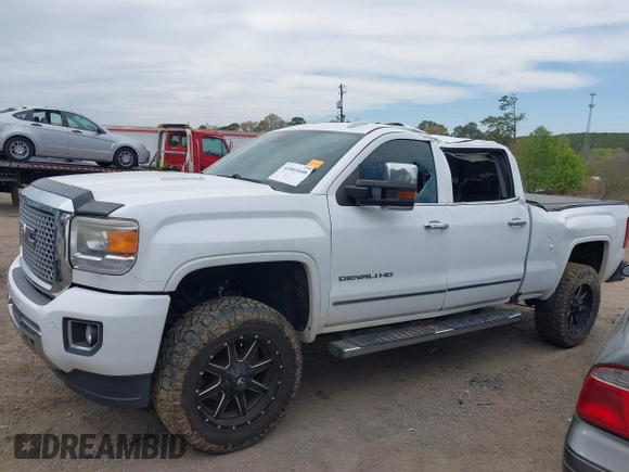 2016 GMC Sierra 2500HD Denali z VIN 1GT12UE82GF130096, wystawiony jako IAAI lot #41869448 z przebiegiem 129 659 mil mil oraz . Historia ofert i sprzedaży dostępna na DreamBid. Obrazek 6.
