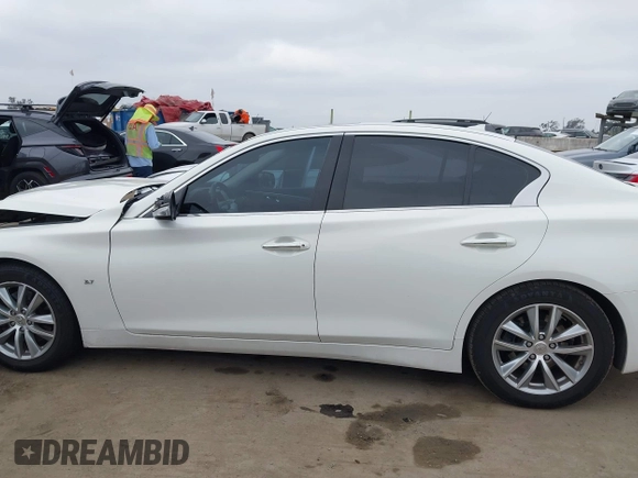 2015 Infiniti Q50 Premium z VIN JN1BV7AP2FM344044, wystawiony jako IAAI lot #42217012 z przebiegiem 155 714 mil mil oraz . Historia ofert i sprzedaży dostępna na DreamBid. Obrazek 14.