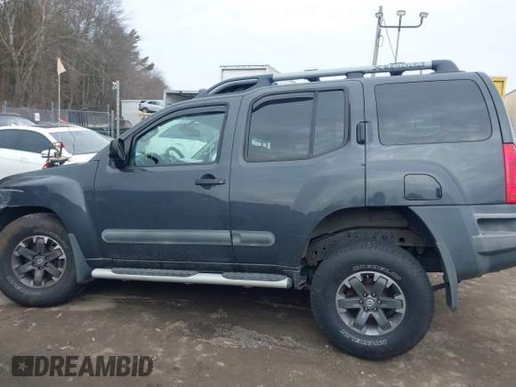 2014 Nissan Xterra X with VIN 5N1AN0NW5EN810488, listed as a IAAI auction lot 41705791 with 127,936 mi miles and . Bid and sale history available at DreamBid. Image 14.