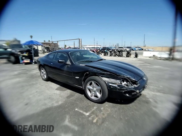 1997 Jaguar XK with VIN SAJGX5740VC014035, listed as a Copart auction lot 53066215 with 140,692 mi miles and Salvage Title. Bid and sale history available at DreamBid. Image 11.
