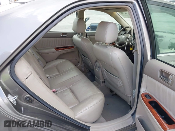 2004 Toyota Camry LE with VIN 4T1BF32K84U588764, listed as a IAAI auction lot 42126345 with 144,642 mi miles. Bid and sale history available at carsss.com. Image 8.