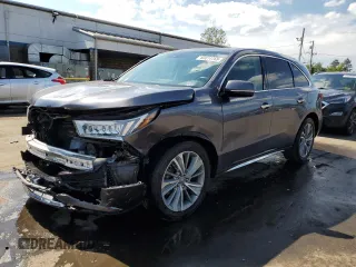 2018 Acura MDX Technology with VIN 5J8YD4H57JL010895, listed as a Copart auction lot 63014765 with 69,701 mi miles and Salvage title. Bid and sale history available at DreamBid. Image 1.