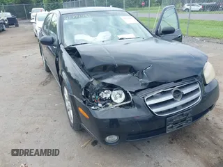 2002 Nissan Maxima GXE with VIN JN1DA31D52T429057, listed as a IAAI auction lot 42771435 with 122,398 mi miles and . Bid and sale history available at DreamBid. Image 6.