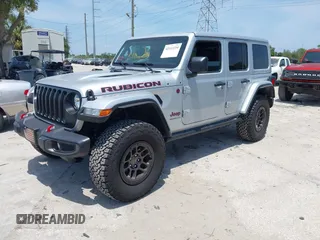 2023 Jeep Wrangler Rubicon with VIN 1C4JJXFG0PW522651, listed as a IAAI auction lot 42112210 with 7,744 mi miles and . Bid and sale history available at carsss.com. Image 2.