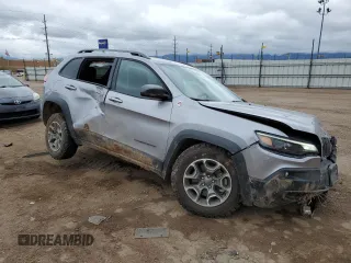 2021 Jeep Cherokee Trailhawk with VIN 1C4PJMBX2MD143446, listed as a Copart auction lot 55166945 with 83,841 mi miles and Salvage title. Bid and sale history available at DreamBid. Image 4.