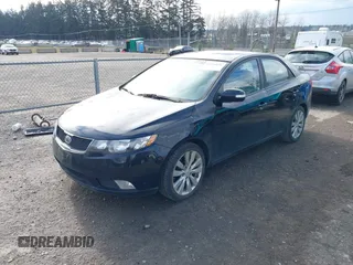 2010 Kia Forte SX with VIN KNAFW4A39A5054469, listed as a IAAI auction lot 41526636 with 115,008 mi miles. Bid and sale history available at carsss.com. Image 2.