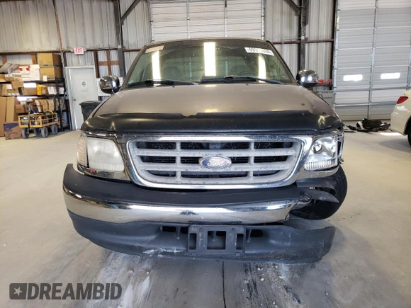 2000 Ford F-150 XL with VIN 1FTZX1726YKB41994, listed as a Copart auction lot 69300034 with Not provided miles and Salvage title. Bid and sale history available at DreamBid. Image 5.