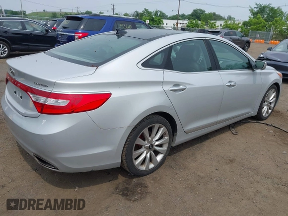 2014 Hyundai Azera Limited z VIN KMHFH4JG0EA396451, wystawiony jako IAAI lot #42493447 z przebiegiem 166 810 mil mil oraz . Historia ofert i sprzedaży dostępna na DreamBid. Obrazek 4.