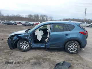 2016 Mazda CX-5 Touring with VIN JM3KE4CY8G0858045, listed as a IAAI auction lot 41941537 with 103,532 mi miles. Bid and sale history available at carsss.com. Image 14.