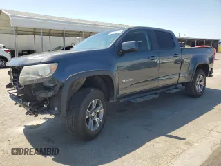 2015 Chevrolet Colorado 2WD Z71 with VIN 1GCGSCE39F1255925, listed as a Copart auction lot 63457735 with 119,801 mi miles and Salvage title. Bid and sale history available at DreamBid. Image 1.