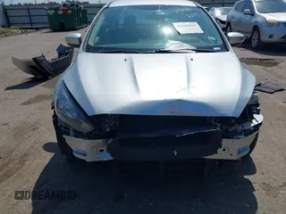 2017 Ford Focus SE with VIN 1FADP3F2XHL256136, listed as a IAAI auction lot 42215479 with 89,945 mi miles and . Bid and sale history available at DreamBid. Image 12.
