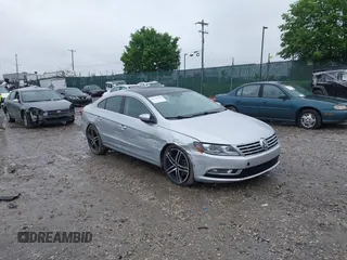 2013 Volkswagen CC Executive z VIN WVWGU7AN1DE511134, wystawiony jako IAAI lot #42222276 z przebiegiem 151 253 mil mil oraz . Historia ofert i sprzedaży dostępna na DreamBid. Obrazek 1.
