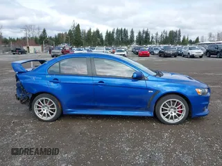 2015 Mitsubishi Lancer Evolution GSR with VIN JA32W8FV4FU012578, listed as a IAAI auction lot 41730742 with 64,762 mi miles. Bid and sale history available at carsss.com. Image 14.