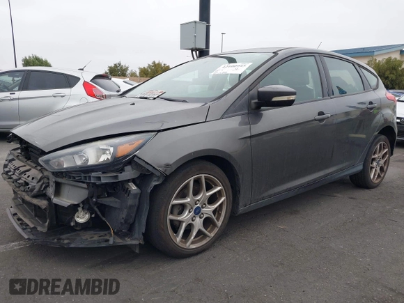 2015 Ford Focus SE with VIN 1FADP3K27FL387012, listed as a IAAI auction lot 42100945 with 85,588 mi miles. Bid and sale history available at carsss.com. Image 2.