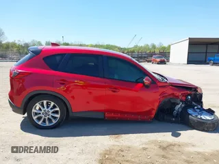 2015 Mazda CX-5 Grand Touring with VIN JM3KE4DY5F0469439, listed as a IAAI auction lot 42053851 with 70,676 mi miles. Bid and sale history available at carsss.com. Image 13.