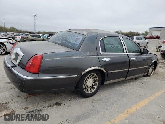 2001 Lincoln Town Car Signature with VIN 1LNHM82W11Y683915, listed as a Copart auction lot 50395865 with Not provided miles and Non repairable. Bid and sale history available at DreamBid. Image 3.