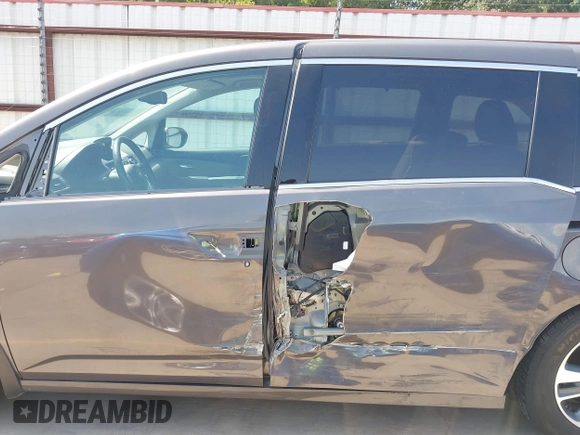 2014 Honda Odyssey Touring with VIN 5FNRL5H99EB075979, listed as a IAAI auction lot 42520154 with 99,314 mi miles and . Bid and sale history available at DreamBid. Image 15.