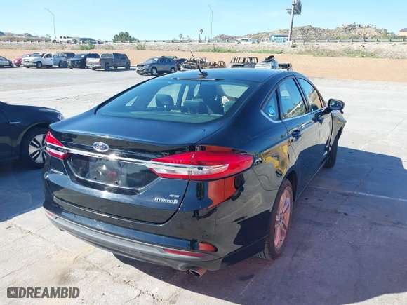 2018 Ford Fusion Hybrid SE with VIN 3FA6P0LU5JR257120, listed as a IAAI auction lot 41859050 with 142,524 mi miles. Bid and sale history available at carsss.com. Image 4.