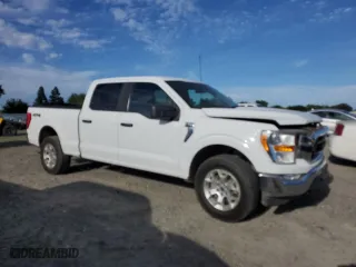 2021 Ford F-150 XL with VIN 1FTFW1E83MFB80686, listed as a Copart auction lot 52386125 with 156,582 mi miles and Salvage Title. Bid and sale history available at carsss.com. Image 4.