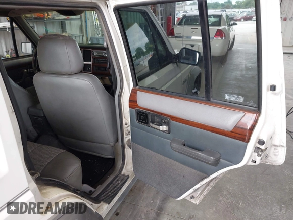 1996 Jeep Cherokee Country z VIN 1J4FT78S0TL280645, wystawiony jako IAAI lot #42340813 z przebiegiem 288 418 mil mil oraz . Historia ofert i sprzedaży dostępna na DreamBid. Obrazek 8.