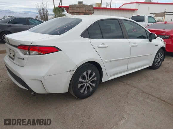 2021 Toyota Corolla Hybrid LE with VIN JTDEAMDE6MJ008815, listed as a IAAI auction lot 41586643 with 7,548 mi miles. Bid and sale history available at carsss.com. Image 4.