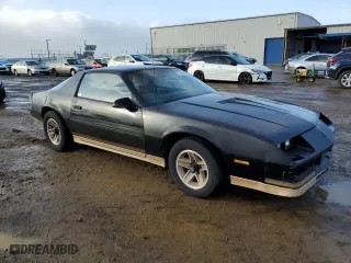 1984 Chevrolet Camaro Z28 Sport with VIN 1G1AP87G7EL175104, listed as a Copart auction lot 86895534 with 27,874 mi miles and Salvage Title. Bid and sale history available at carsss.com. Image 4.