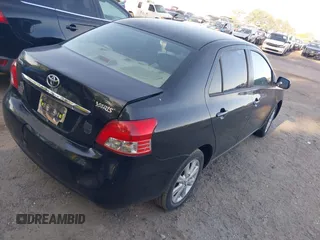 2009 Toyota Yaris with VIN JTDBT903894044347, listed as a IAAI auction lot 42069061 with 197,348 mi miles. Bid and sale history available at carsss.com. Image 4.