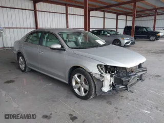 2014 Volkswagen Passat Wolfsburg Ed with VIN 1VWAS7A32EC036193, listed as a IAAI auction lot 41606595 with 77,536 mi miles. Bid and sale history available at carsss.com. Image 1.