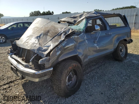 1989 Ford Bronco with VIN 1FMCU14T0KUA33910, listed as a Copart auction lot 57730195 with 53,335 mi miles and Salvage title. Bid and sale history available at DreamBid. Image 1.