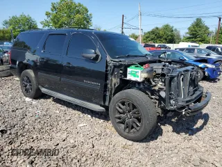 2014 Chevrolet Suburban LT with VIN 1GNSKJE72ER131763, listed as a Copart auction lot 69026754 with 186,248 mi miles and Salvage Title. Bid and sale history available at carsss.com. Image 4.