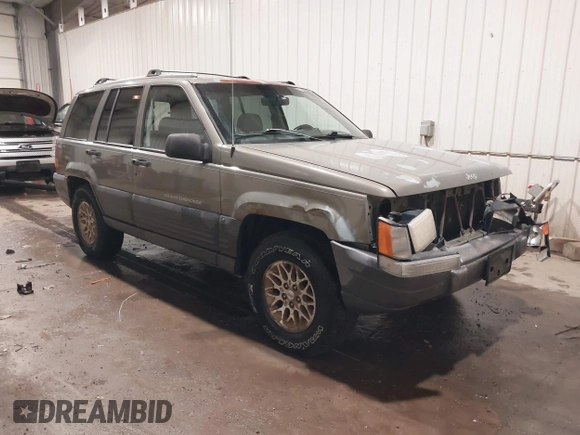 1996 Jeep Grand Cherokee Laredo with VIN 1J4GZ58S5TC182766, listed as a IAAI auction lot 41372356 with 234,390 mi miles. Bid and sale history available at carsss.com. Image 1.
