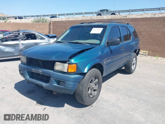 1998 Isuzu Rodeo S z VIN 4S2CM58W8W4328196, wystawiony jako IAAI lot #42323556 z przebiegiem 272 915 mil mil oraz . Historia ofert i sprzedaży dostępna na DreamBid. Obrazek 2.