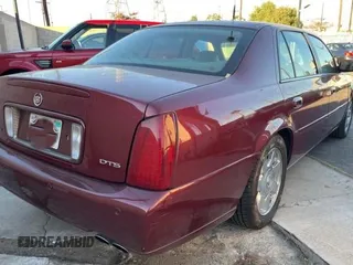 2002 Cadillac DeVille DTS with VIN 1G6KF57912U135771, listed as a Copart auction lot 82052554 with 56,268 mi miles and Clean Title. Bid and sale history available at carsss.com. Image 4.