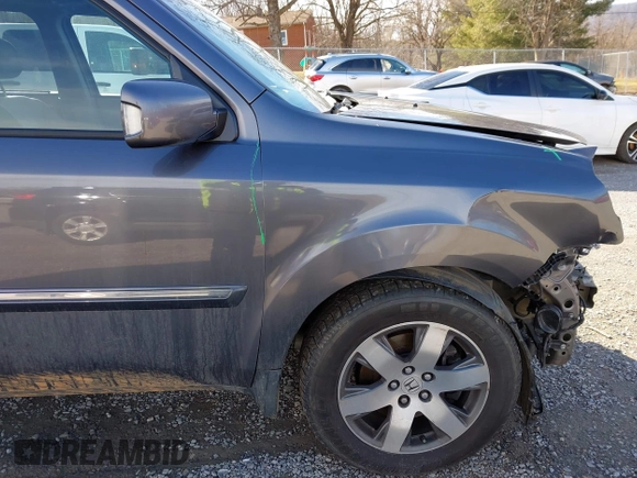 2014 Honda Pilot Touring with VIN 5FNYF4H95EB019048, listed as a IAAI auction lot 41526958 with 172,252 mi miles and . Bid and sale history available at DreamBid. Image 19.