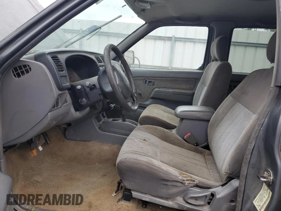 2000 Nissan Frontier XE with VIN 1N6ED27T2YC311037, listed as a Copart auction lot 57901285 with Not provided miles and Salvage title. Bid and sale history available at DreamBid. Image 7.