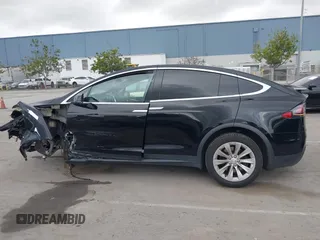 2017 Tesla Model X 90D with VIN 5YJXCAE2XHF075341, listed as a IAAI auction lot 41784008 with 77,439 mi miles and . Bid and sale history available at DreamBid. Image 15.
