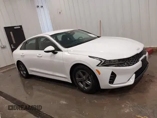 2023 Kia K5 LXS z VIN 5XXG14J2XPG189462, wystawiony jako IAAI lot #42233595 z przebiegiem 17 286 mil mil oraz . Historia ofert i sprzedaży dostępna na DreamBid. Obrazek 13.