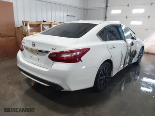 2018 Nissan Altima 2.5 SL with VIN 1N4AL3AP7JC151500, listed as a IAAI auction lot 41330909 with 142,536 mi miles. Bid and sale history available at carsss.com. Image 4.