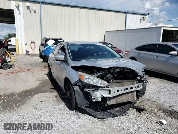 2016 Ford Focus SE z VIN 1FADP3F24GL309119, wystawiony jako Copart lot #62279095 z przebiegiem 117 535 mil mil oraz Szkoda całkowita • Salvage title. Historia ofert i sprzedaży dostępna na DreamBid. Obrazek 14.