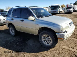 1999 Suzuki Grand Vitara JLX z VIN JS3TD62V0X4113058, wystawiony jako Copart lot #80089884 z przebiegiem 165 794 mil mil oraz Szkoda całkowita • Salvage title. Historia ofert i sprzedaży dostępna na DreamBid. Obrazek 4.