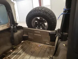 2004 Jeep Wrangler Rubicon z VIN 1J4FA69S44P784141, wystawiony jako Copart lot #55235305 z przebiegiem 125 564 mil mil oraz Szkoda całkowita • Salvage title. Historia ofert i sprzedaży dostępna na DreamBid. Obrazek 11.