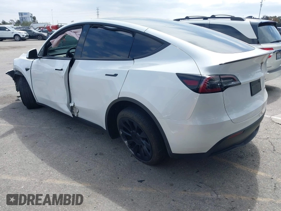 2023 Tesla Model Y Long Range with VIN 7SAYGDEE9PA026005, listed as a IAAI auction lot 41895223 with 43,813 mi miles and . Bid and sale history available at DreamBid. Image 3.