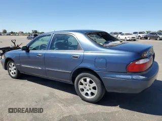 2002 Mazda 626 LX with VIN 1YVGF22C825293243, listed as a Copart auction lot 61084684 with 217,339 mi miles and Salvage Title. Bid and sale history available at carsss.com. Image 2.