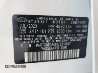 2023 Genesis G70 2.0T with VIN KMTG34TA0PU131807, listed as a Copart auction lot 66194774 with 12,185 mi miles and Salvage Title. Bid and sale history available at DreamBid. Image 12.