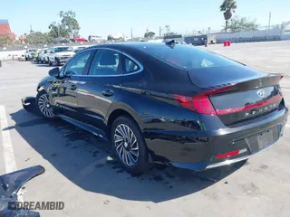 2023 Hyundai Sonata Hybrid SEL with VIN KMHL34JJ0PA058709, listed as a IAAI auction lot 41723513 with 56,495 mi miles. Bid and sale history available at carsss.com. Image 3.
