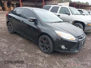 2013 Ford Focus SE z VIN 1FADP3F24DL212319, wystawiony jako IAAI lot #41627600 z przebiegiem 207 063 mil mil oraz . Historia ofert i sprzedaży dostępna na DreamBid. Obrazek 1.