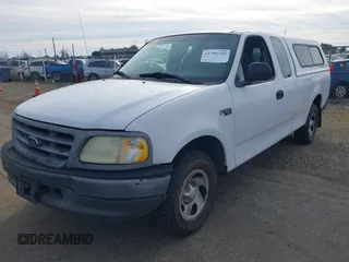 2002 Ford F-150 XL with VIN 1FTRX17222NB82564, listed as a IAAI auction lot 41701719 with 1 mi miles. Bid and sale history available at carsss.com. Image 2.
