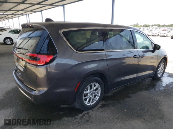 2023 Chrysler Pacifica Touring L with VIN 2C4RC1BG1PR581376, listed as a Copart auction lot 59901915 with 57,411 mi miles and Salvage title. Bid and sale history available at DreamBid. Image 3.