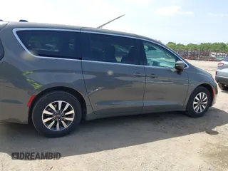 2023 Chrysler Pacifica Hybrid Touring L with VIN 2C4RC1L73PR522988, listed as a IAAI auction lot 42280263 with 54,939 mi miles and . Bid and sale history available at DreamBid. Image 13.