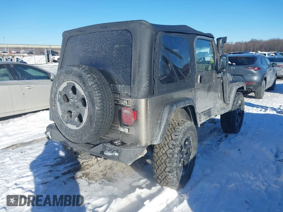 2004 Jeep Wrangler Sahara with VIN 1J4FA59S94P731123, listed as a IAAI auction lot 41288284 with 138,515 mi miles and . Bid and sale history available at DreamBid. Image 4.